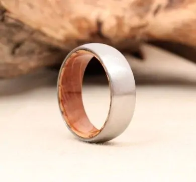 titanium wood ring lined with whiskey barell white oak stave