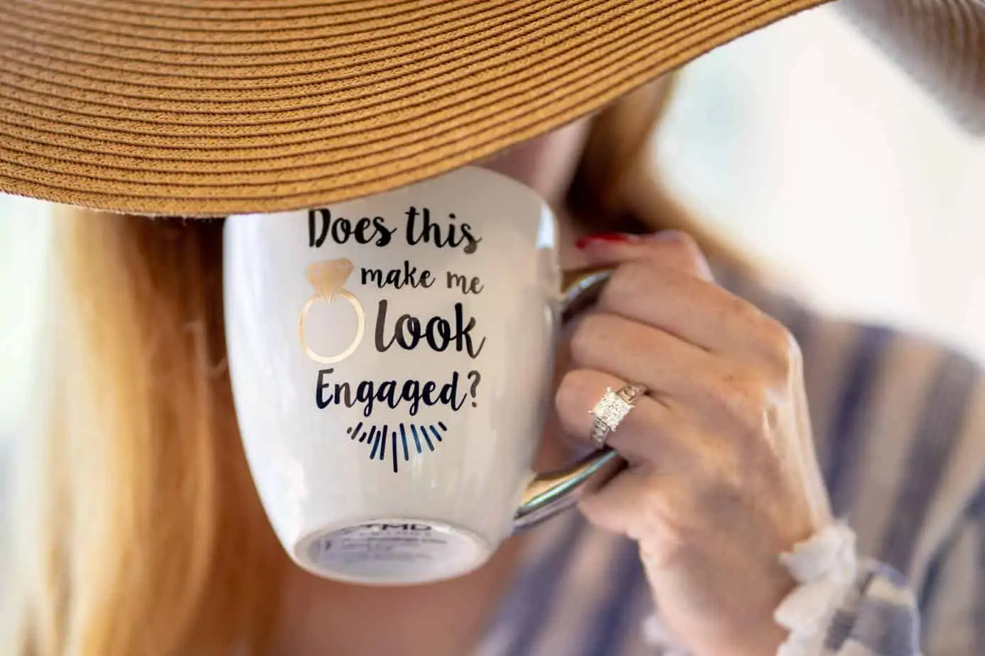 person holding white ceramic mug