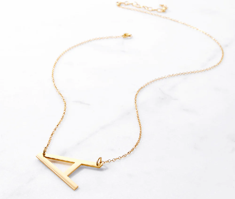 oversize, sideways initial necklace